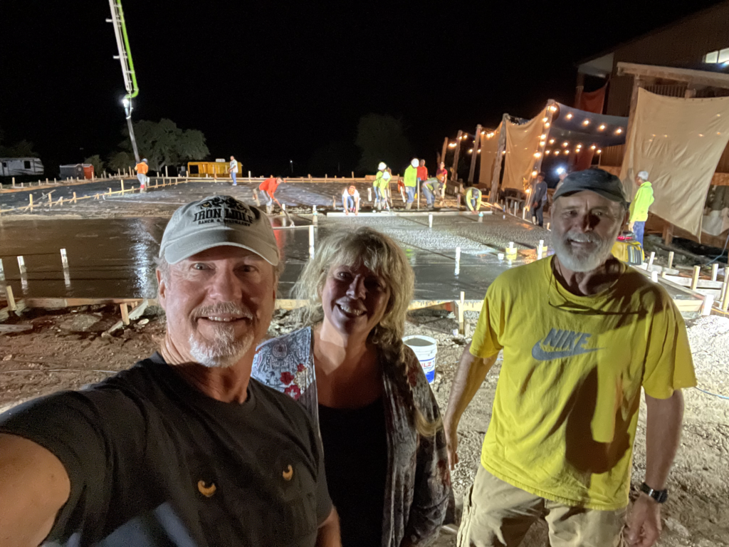 Glenda, Jordan & Randy in front of the slab for building 2 at Iron Wolf